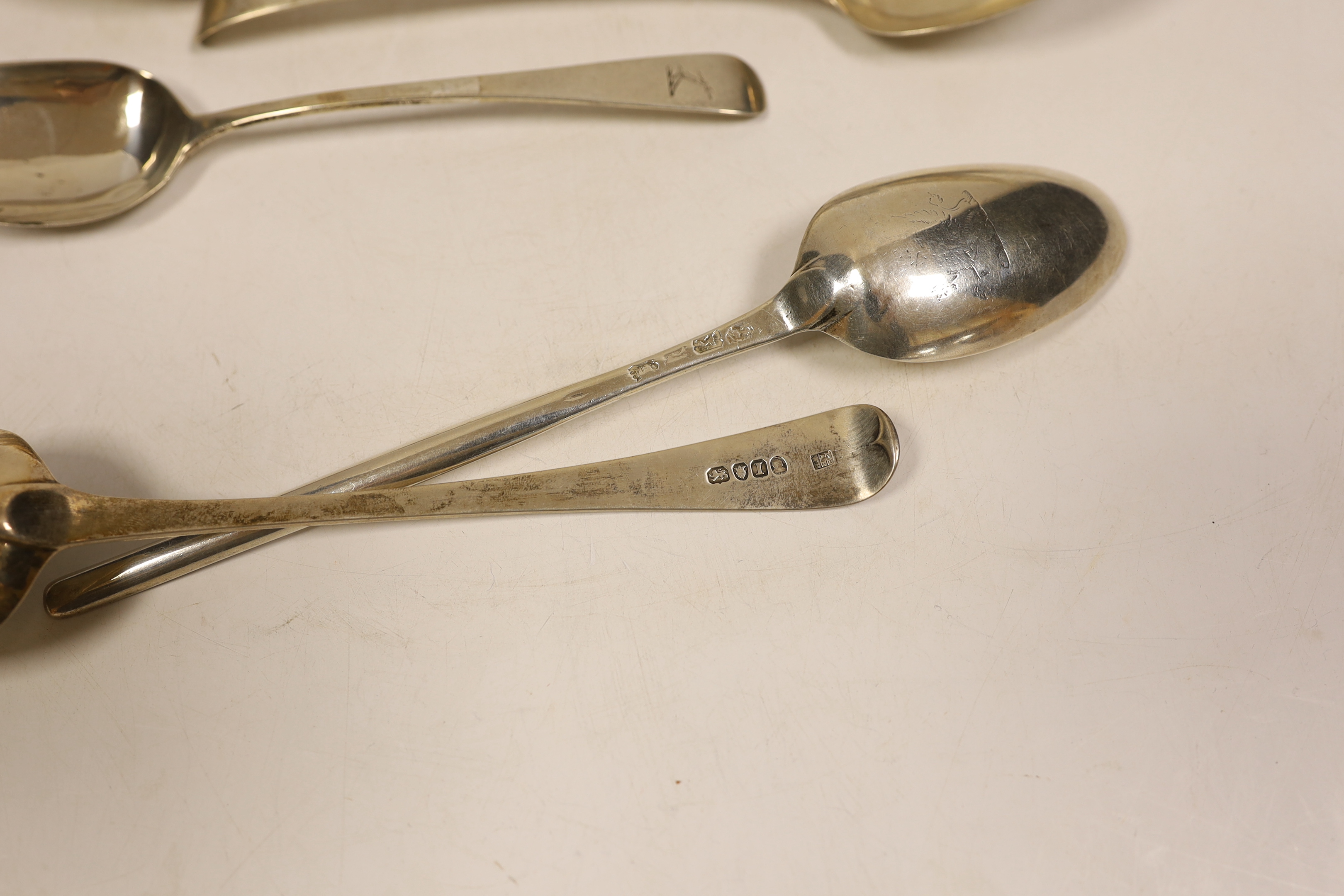 A George II silver marrow scoop spoon, London, 1745?, 24cm, a pair of George III silver Old English pattern table spoons, Peter, Ann & William Bateman, London, 1804, two other George III table spoons and two pairs of Bat